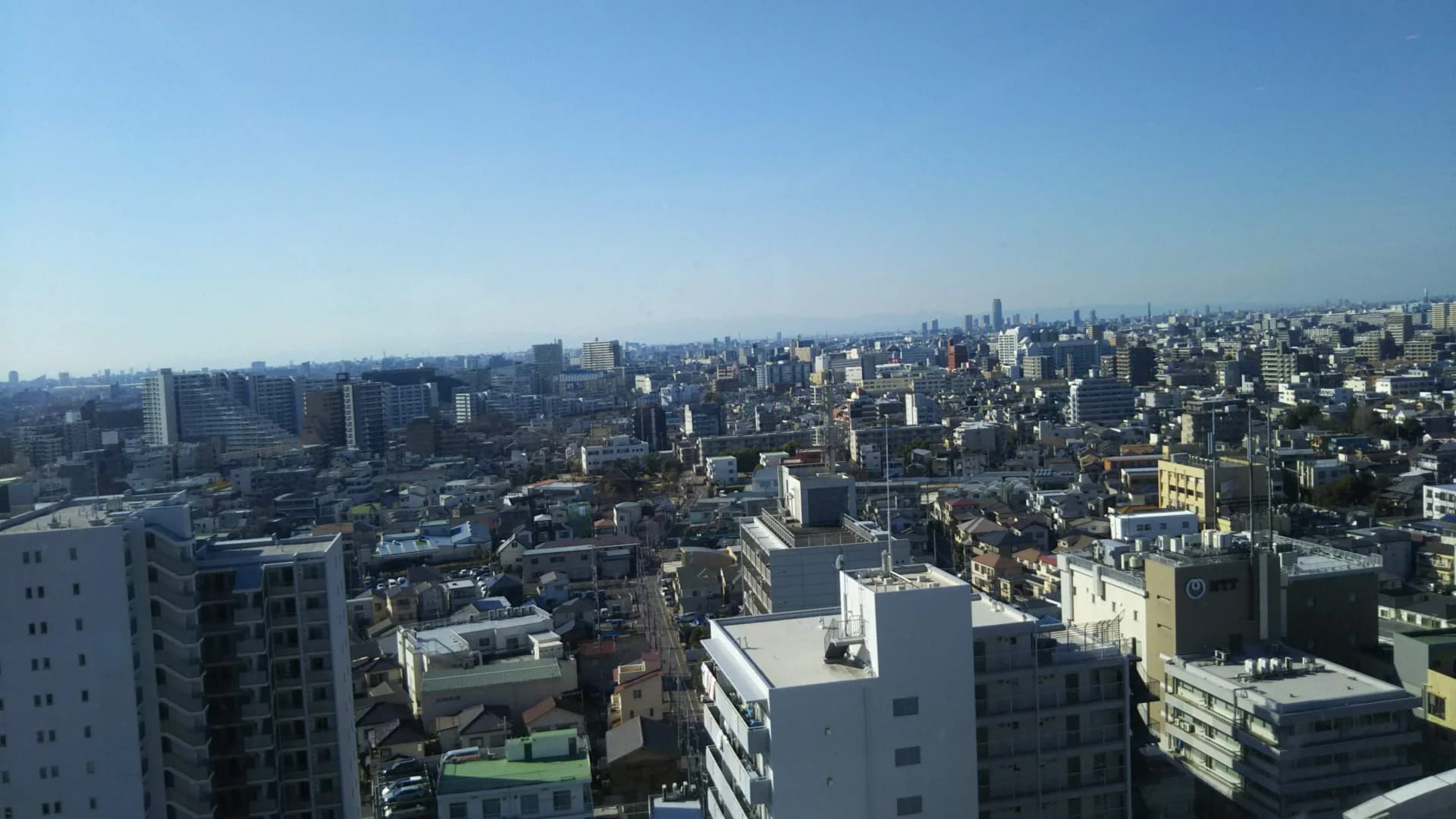 高所から見た足立区の戸建て住宅とマンションが密集する街並み（足立区の空き家買取のイメージ）